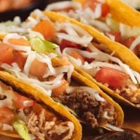 Taco Supreme · Three hard or soft tacos of beef or chicken. Topped with lettuce, tomatoes, sour cream and c...