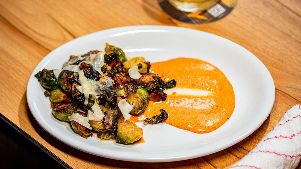 Brussels Sprouts · Pork belly lardons, toasted garlic, crispy capers, 
shaved parmesan, smoked tomato aioli