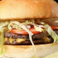 The Morrie Burger · Double patty, American cheese, lettuce, pickle, 
red onion, Morrie house sauce
