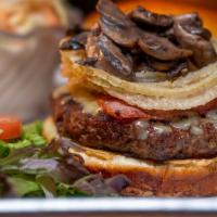 Irish Times Burger · Bacon, Irish Cheddar, Beer Braised Mushrooms, & Fried Onions served atop our Grilled Angus P...