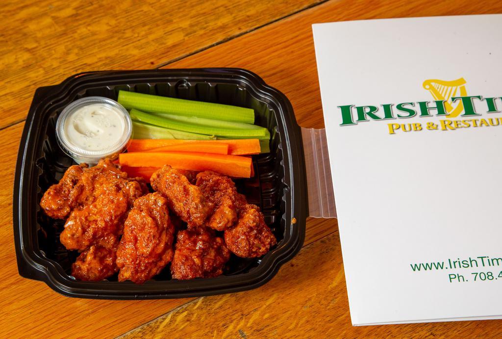 Buffalo Wings · Eight boneless or bone in wings tossed in buffalo, served with celery, carrots and ranch