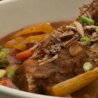 Guinness Beef Stew · Fresh Veggies & Tender Beef braised in a rich Guinness Broth topped with Green Onions. Serve...