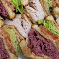 Rachel'S Rhyme · Corned Beef, Turkey breast, swiss cheese, lettuce, tomato, dressing on 4 slices of white toa...