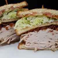 Triple Decker Roasted Turkey Club · Oven Roasted Turkey Breast, bacon, lettuce, tomato and mayo. Served on 3 slices of white toa...