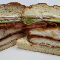 Crispy Chicken Blt · Two crispy breaded chicken breasts, hickory smoked bacon, lettuce, tomato and mayo on an Oni...