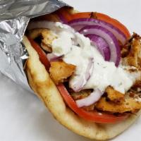 Chicken Gyros · Thinly sliced and marinated grilled chicken breast, sliced onion and tomato topped with our ...