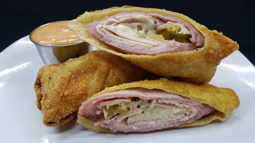 The Bambino Egg Roll · Seasoned turkey breast, Amish ham, melted cheese, banana peppers blended with our italian seasoning.