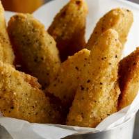 Fried Pickle Spears · Seasoned dill pickle spears breaded and deep fried.