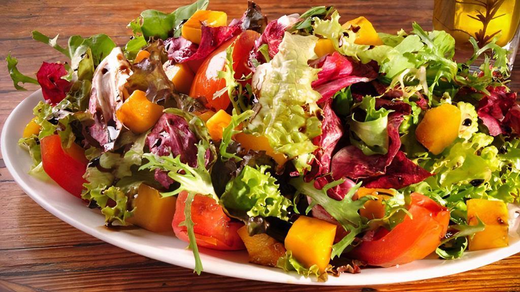 Tropicaliente Salad · Romaine lettuce, tomatoes, purple cabbage, shredded carrots, pecans, apples, mandarin oranges