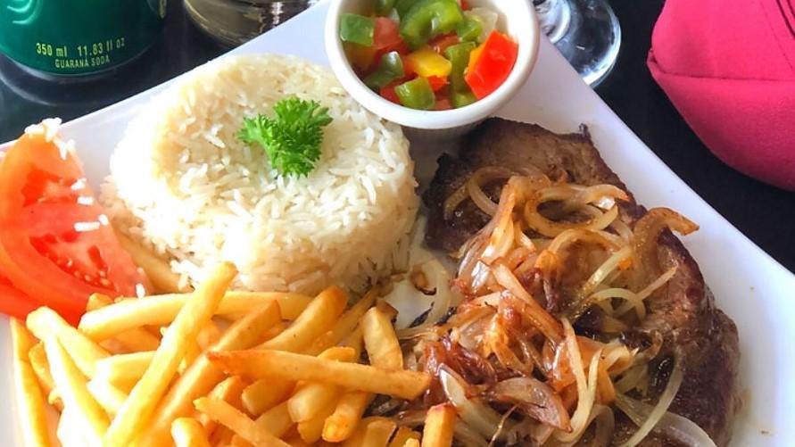 Sirloin Steak With Onions / Bife Acebolado · 8oz sirloin steak, grilled to perfection, loaded with grilled onions and served with white rice and a side of our famous vinaigrette sauce
