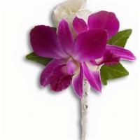 Fresh In Fuchsia Boutonniere · An exotic orchid meets its match in a radiant white rose.
Purple dendrobium orchids with whi...