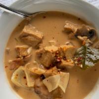 Tom Kha · A creamy soup made with coconut milk, galanga root, lime leaves, and lemongrass. Garnished w...