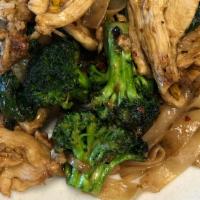 Pad Sea Eaw · Stir fried large rice noodles with egg, sweet dark soy sauce, broccoli, and Khana.