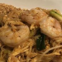 Seafood Pad Thai · Stir-fried rice noodles with prawn, scallops, crab meat, squid and whole peanuts. Served wit...