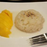 Mango Sticky Rice · Traditional Thai sweet sticky rice with fresh, sliced mango and topped with a coconut cream ...