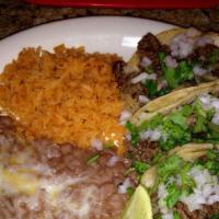 Taco Plate · (3) Tacos served with Rice & Beans.