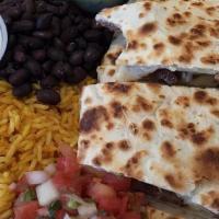Quesadilla Plate · Flour tortillas filled with melted cheese. Served with Pico de Gallo, sour cream and guacamo...