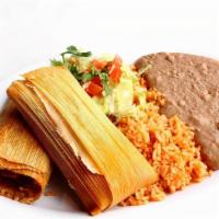 Tamale Plate · (3) Tamales served with rice & beans.