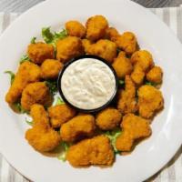 Fried Cauliflower · Fried Cauliflower Pieces with Ranch Dipping Sauce. Plain or Drizzled with Buffalo Sauce