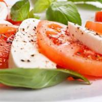 Caprese Salad · Beefsteak Tomatoes, Fresh Mozzarella, and Basil Drizzled with Olive Oil
