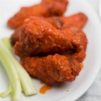 Chicken Wings · Chicken Wings, Cooked to Perfection and Smothered in the Sauce of Your Choice  (Approx. 7 Wi...