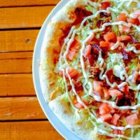Blt Pizza · Roma tomatoes & thick sliced bacon, topped with lettuce and Hellman’s drizzle when out of th...