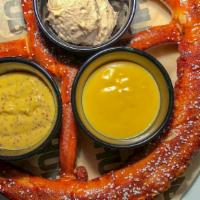Big Axe Pretzel · Our “bigger than your head” pretzel served with a house-made mustard sauce, a warm cheese sa...