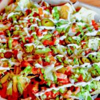 Pizza Box Nacho · Stadium-style nachos topped with choice of picadillo beef or chipotle chicken tinga, refried...