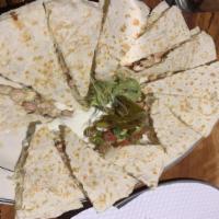 Quesadilla · Choice  of  Steak or Chicken with Jack cheese and pico de gallo sandwiched between two flour...
