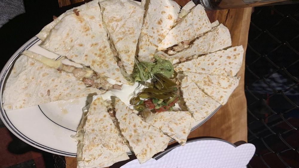 Quesadilla · Choice  of  Steak or Chicken with Jack cheese and pico de gallo sandwiched between two flour tortillas and served with pico de gallo, fresh guacamole and sour cream.