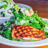 Caesar Salad · Crisp romaine lettuce and house-baked croutons tossed with our Caesar Dressing and dusting o...