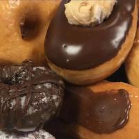 The Fancy Favs Donut Pack · A dozen of our fresh daily hand crafted donuts with a bent towards the elaborate.  We featur...