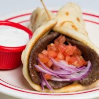 Gyro · Seasoned beef cooked to perfection and wrapped in our own special pita bread with sliced red...