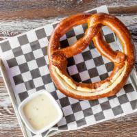Giant Pretzel · Served with queso and spicy mustard per request.