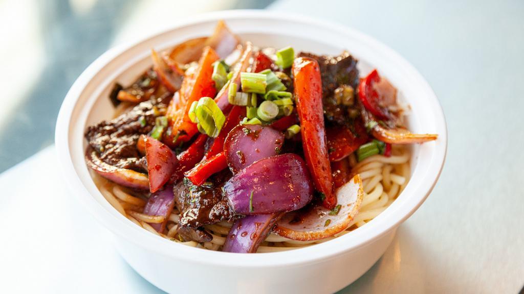 Tallarin Saltado · Spaghetti noodles cooked with onions, tomatoes, red peppers and soy based sauce.