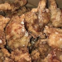 Popcorn Chicken · Our famous chicken is double fried and spun in a choice of homemade sauce. served with pickl...