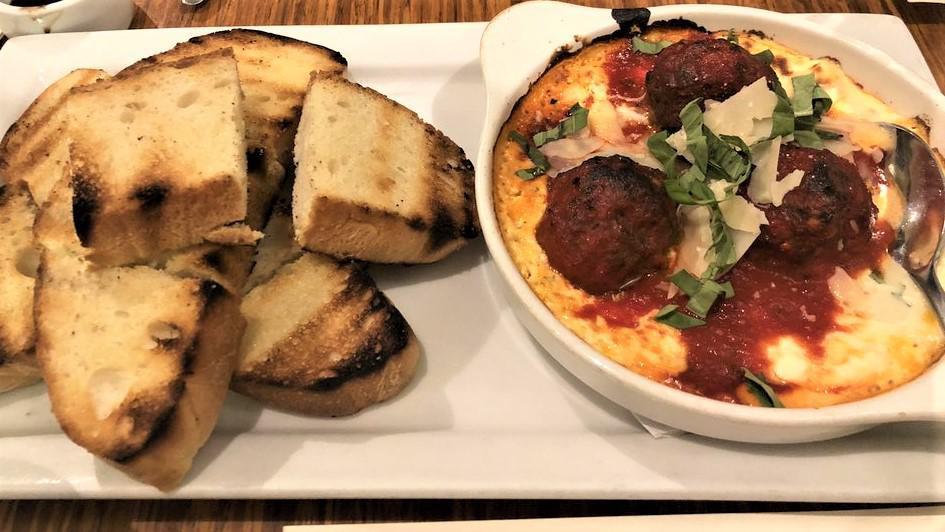 House Ground Meatballs · Beef & pork, herbed ricotta, pomodoro, basil, shaved parmesan, and grilled ciabatta toast.