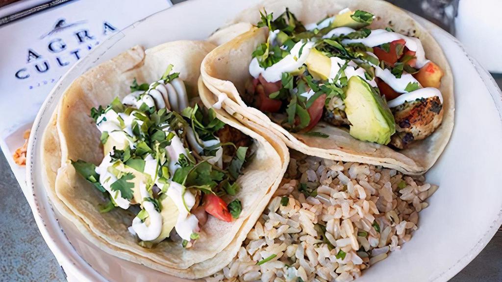 Tacos · sautéed all-natural chicken or tofu, pico de gallo, sliced avocado, topped with chimichurri sauce & lime crème fraîche on corn tortillas – served with cilantro brown rice