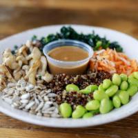 Skinny Buddha · organic raw kale salad, sliced avocado, truffled mushrooms, pickled daikon & carrots, edamam...