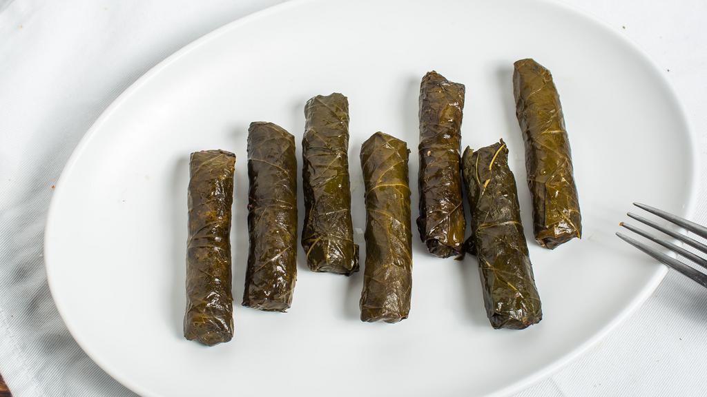 Meat Stuffed Grape Leaves · Six grape leaves stuffed with meat and rice in the Lebanese tradition.