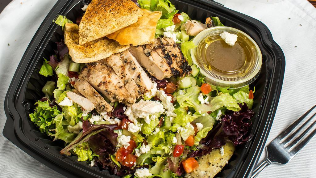 Greek Salad · Mixed greens with tomatoes, cucumbers, artichoke hearts, kalamata olives and Feta cheese; dressed with a white balsamic vinaigrette dressing.