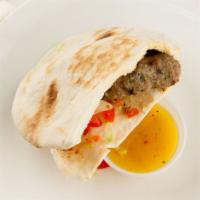 Beef Kafta Sandwich · Char-broiled ground black Angus beef seasoned with chopped parsley, onions and spices in pit...
