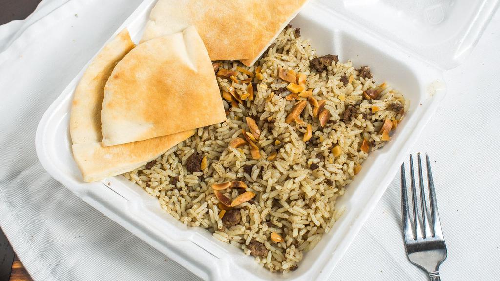 Hashwa Plate · A generous serving of our signature dish, made with beef, rice and a mixture of special seasonings - cooked with clarified butter and topped with toasted almonds.