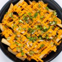 Say Cheese! · Our original crispy fries, topped with melted cheese and garnished with green onions. Served...