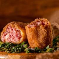 Reuben Egg Roll · A crispy egg roll loaded with corned beef, sauerkraut, and Swiss cheese. Served with a side ...