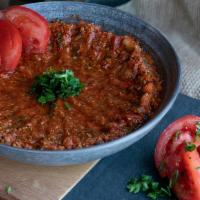 Tomato Kibbeh · A delicious mix of fresh tomato, cracked wheat, onions, and our famous spices blend