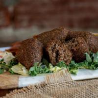 Fried Kibbeh Plate · A mix of fried minced meat, sautéed onion and fine spices coated in a blend of meat and crac...