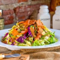 Fattoush Salad · A delicious combination of crisp romaine lettuce, tomato, cucumber, onion, shredded carrots ...