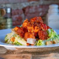 Crispy Chicken Caesar Salad · Crisp romaine lettuce, topped with grated parmesan cheese, garlic whole grain croutons and y...