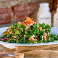 Kale Quinoa Salad · A wholesome mix of fresh Kale, quinoa, diced tomato, and onion. Served with oil and lemon dr...